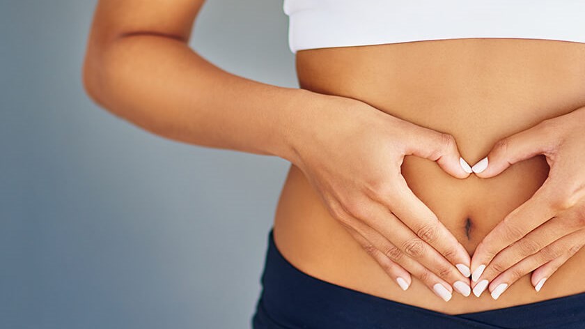 woman holding her stomach